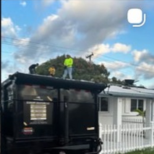 Seahawks Solutions black trailer at a residential job